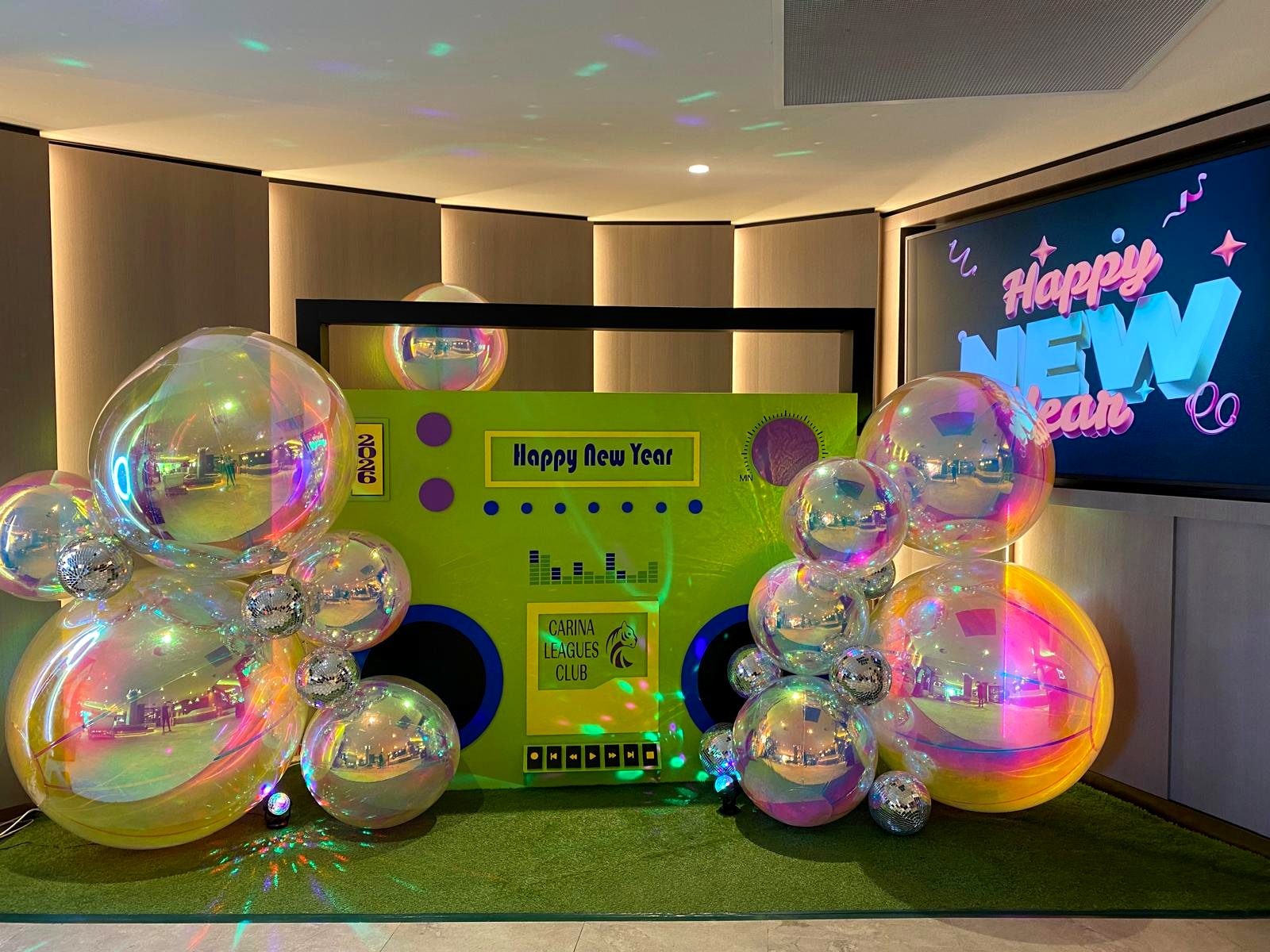Happy New Year disco boombox display with mirror balls at Carina Leagues Club