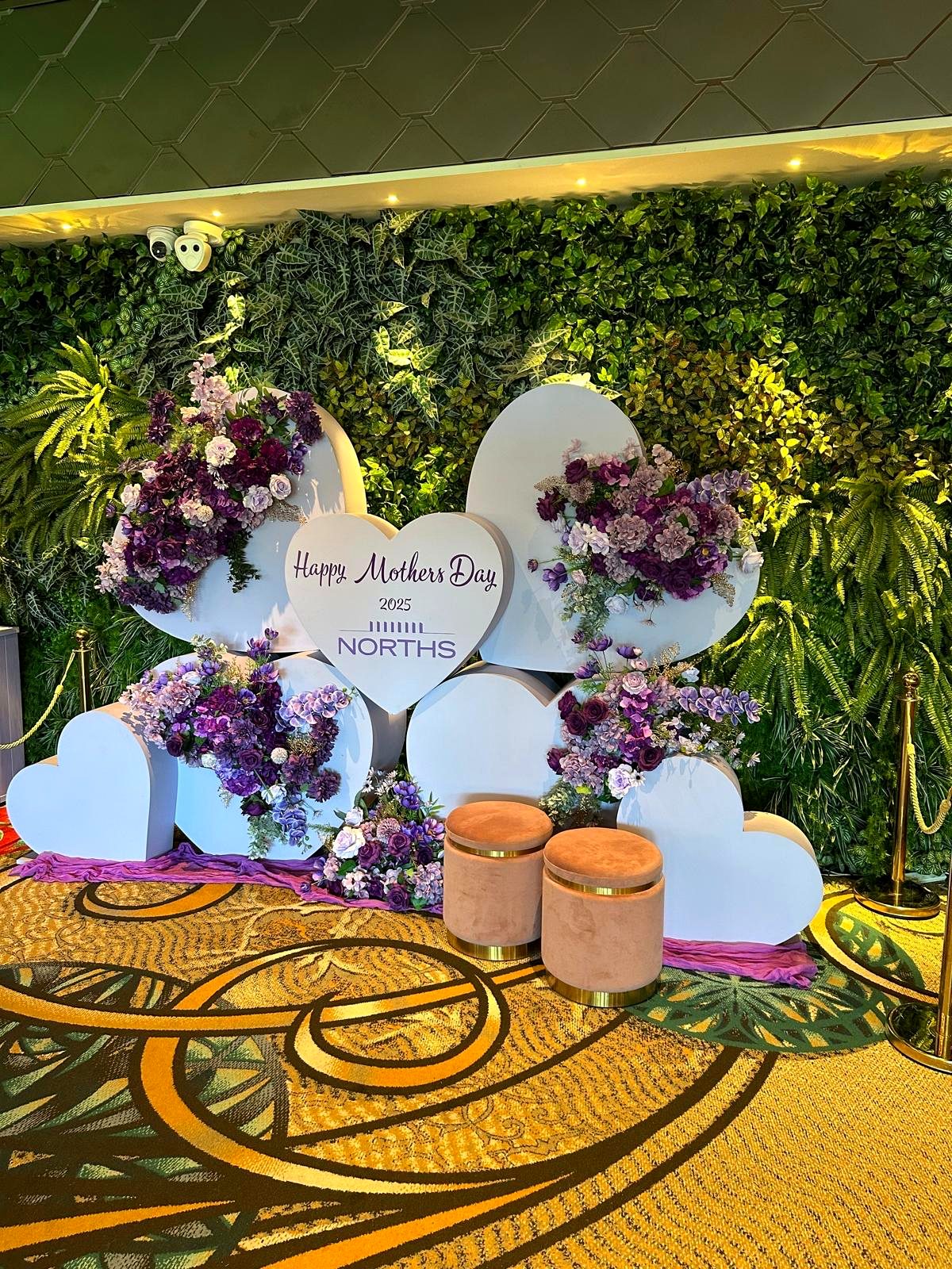 Purple floral heart wall Mother's Day display at Norths