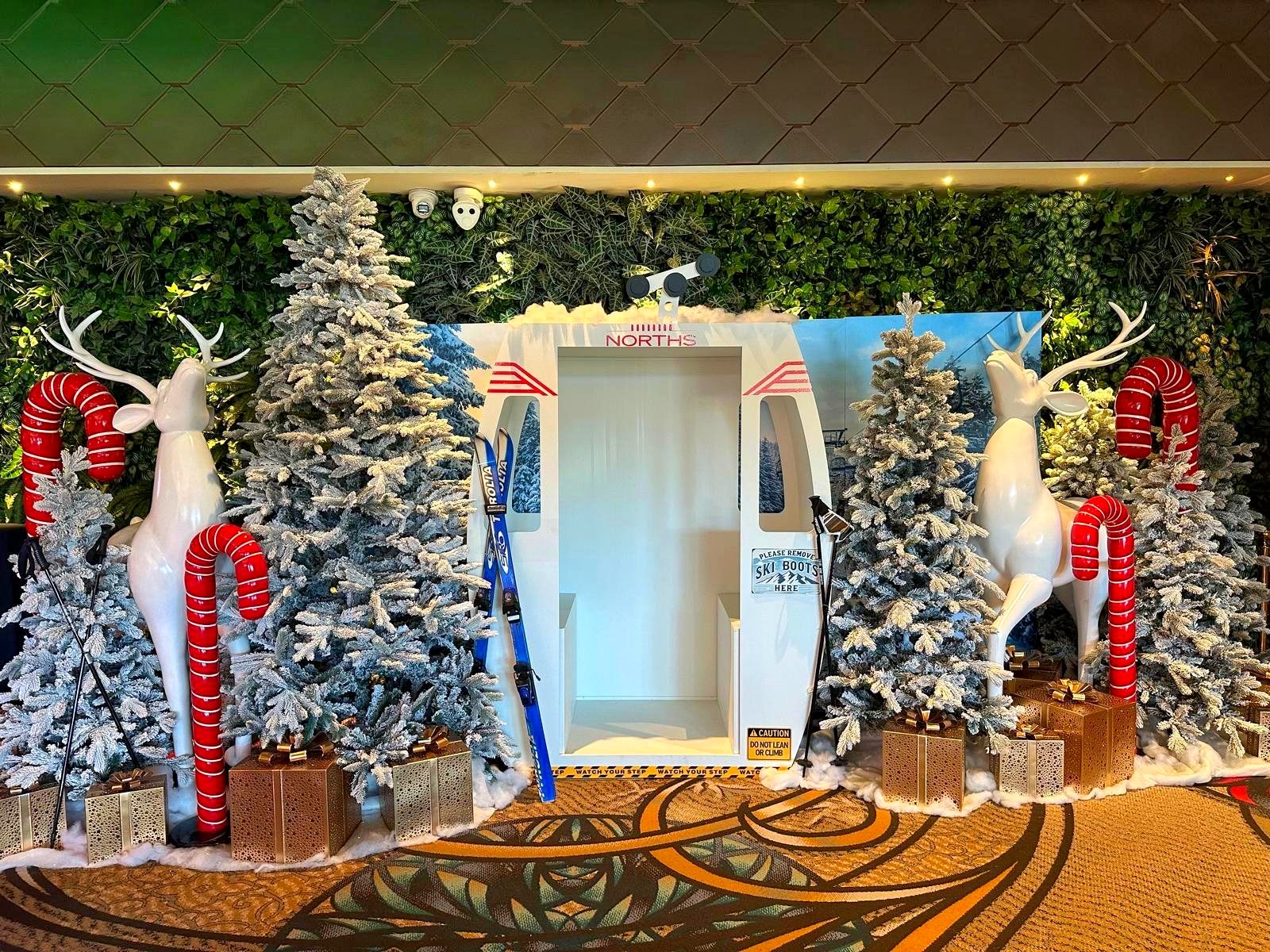 Ski gondola Christmas photo moment at Norths with reindeer and flocked trees