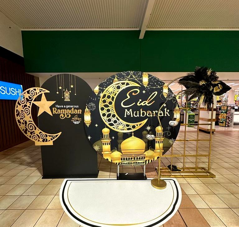 Eid Mubarak and Ramadan black and gold moon display in a shopping centre