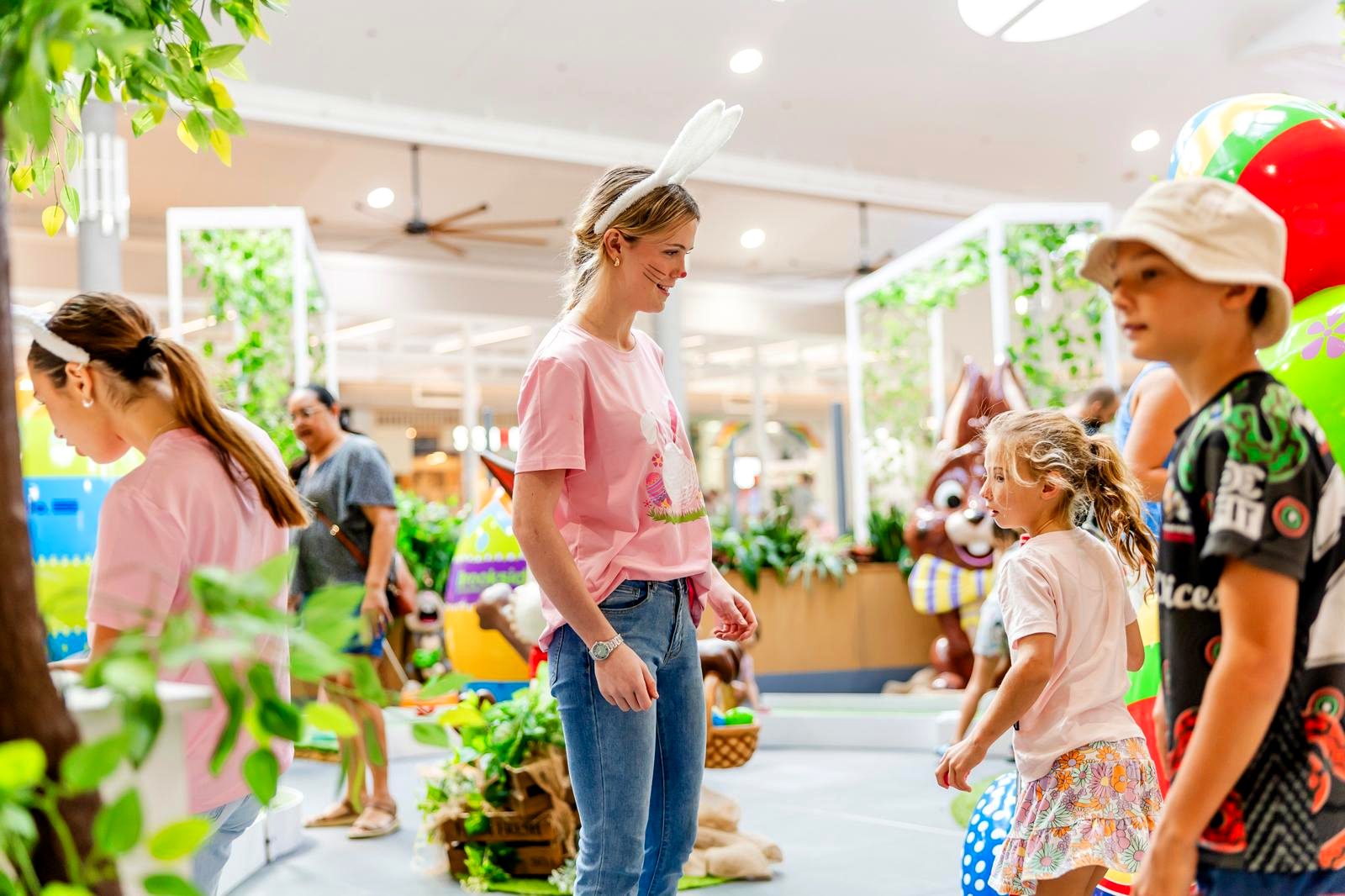 Activation ambassador engaging with children at an Easter shopping centre event