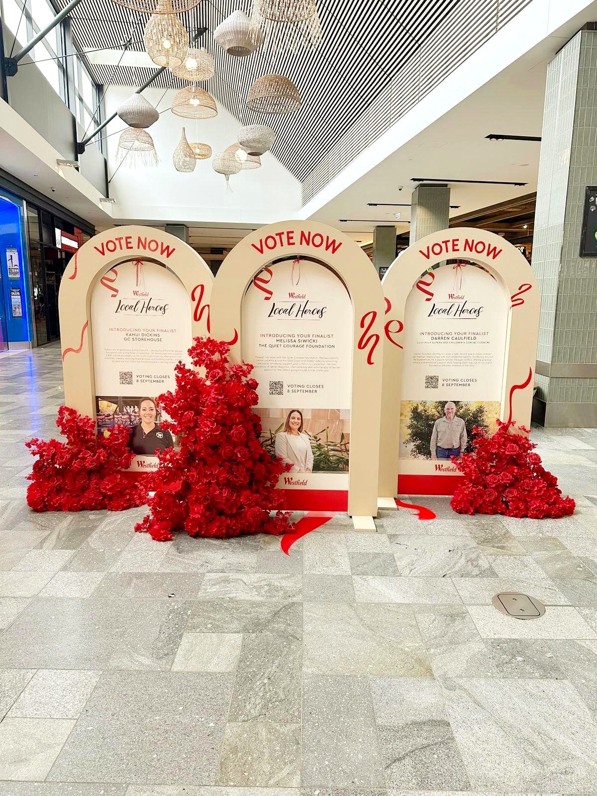 Westfield Local Heroes voting display with red rose floral installation